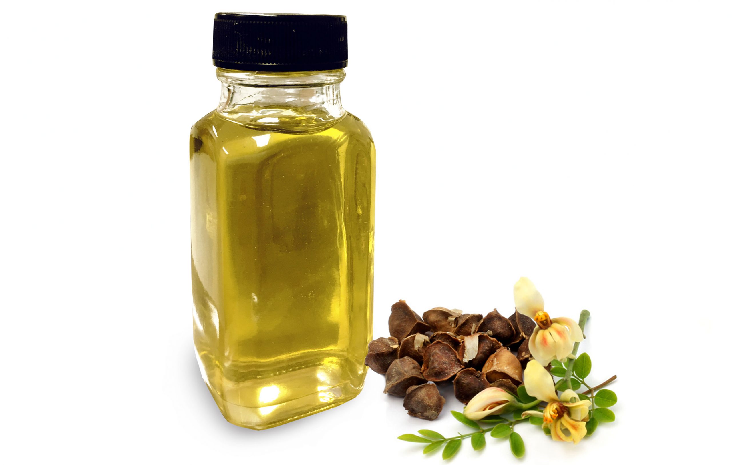 Moringa seed oil bottle with seeds and flowers